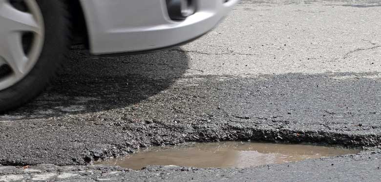 What to do if your car is damaged by a pothole