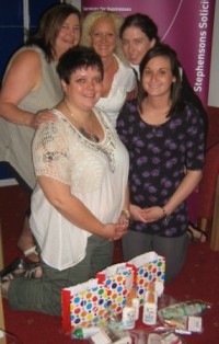 Melanie Varey (back row centre) and Rebecca Mason (back row right) of Stephensons, pictured with staff from the refuge