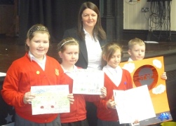 Rebecca Shippam with the prize winners at Leigh Junior School